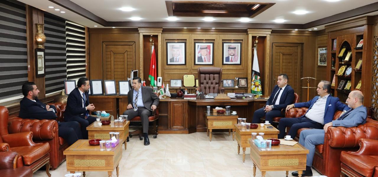 بحث تعزيز التعاون بين جامعة البلقاء التطبيقية والبنك الأهلي الأردن